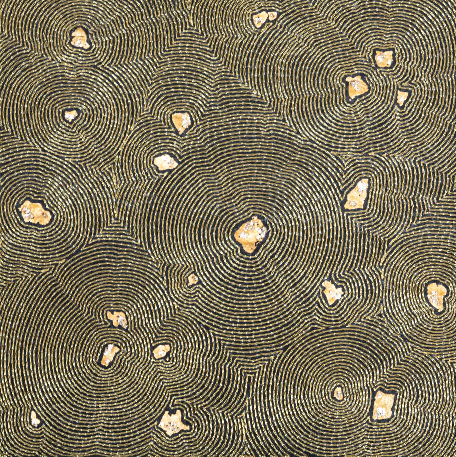 Motif circulaire doré et noir texturé